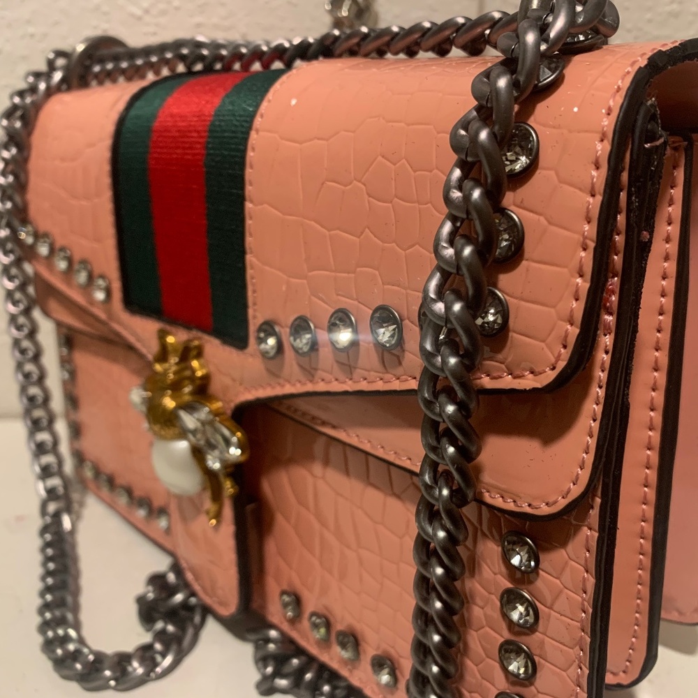 Pink snakeskin bee purse